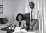 Black and White Photo of Mona Asberom and James Leonard Brown in Their Law Office by Las Vegas Chapter of the National Bar Association