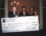 Photograph of Three Individuals Holding Large Check by Las Vegas Chapter of the National Bar Association