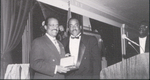 Black and White Photograph of (L-R) Johnnie Cochran and Bryan Scott, One Is Receiving an Award by Las Vegas Chapter of the National Bar Association