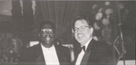 Black and White Photograph of Two Individuals by Las Vegas Chapter of the National Bar Association