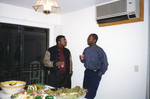 Photograph of Two Individuals Talking by Las Vegas Chapter of the National Bar Association
